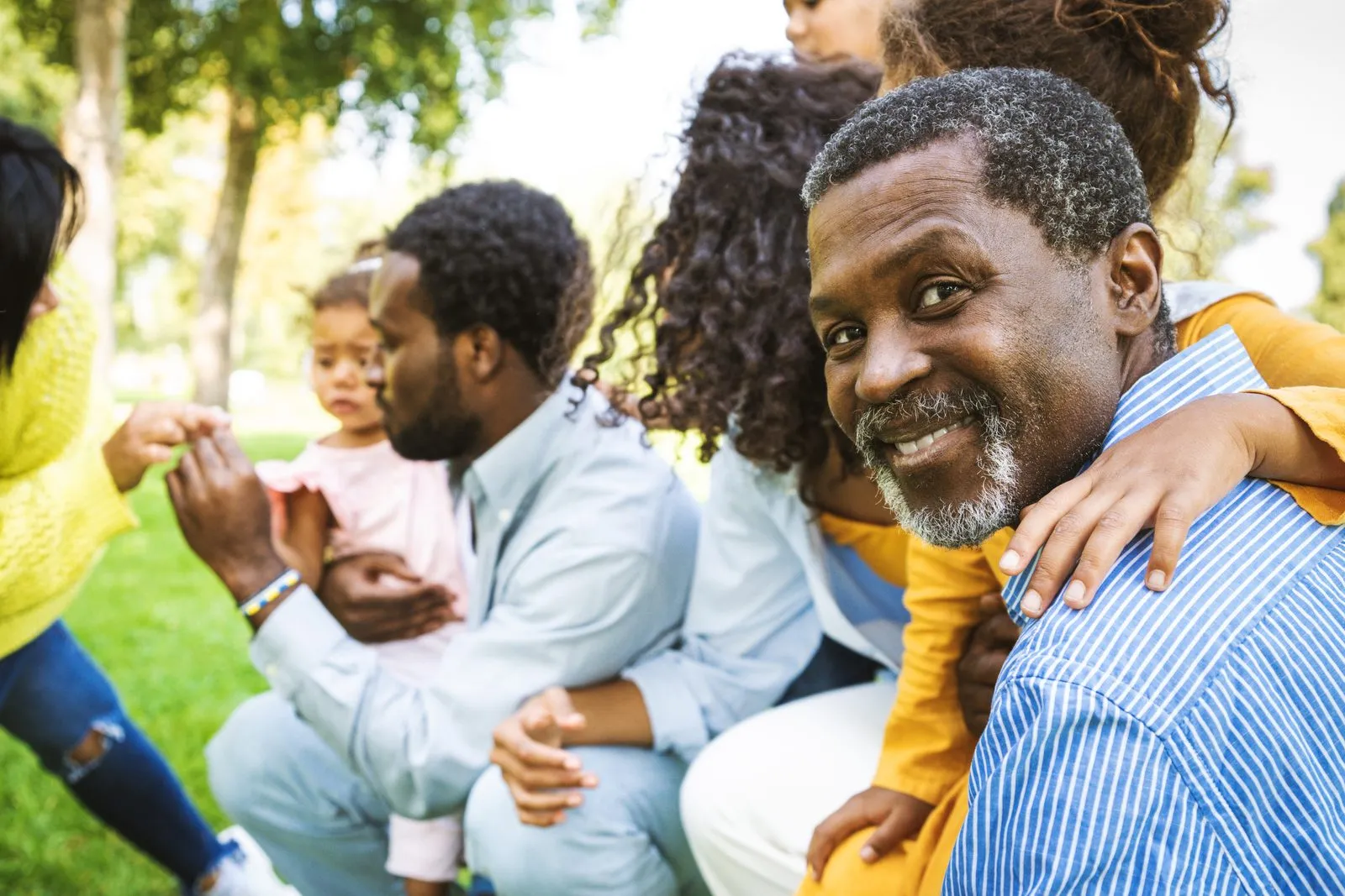 A man smiling with the family he built his business to provide for